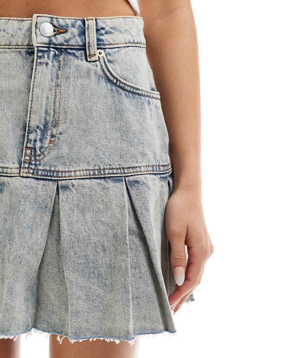 Monki low rise denim skirt with pleated raw hem in tinted blue wash