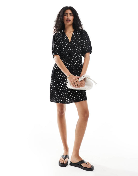 Vila mini dress with tie bow back in black and white polka dot print