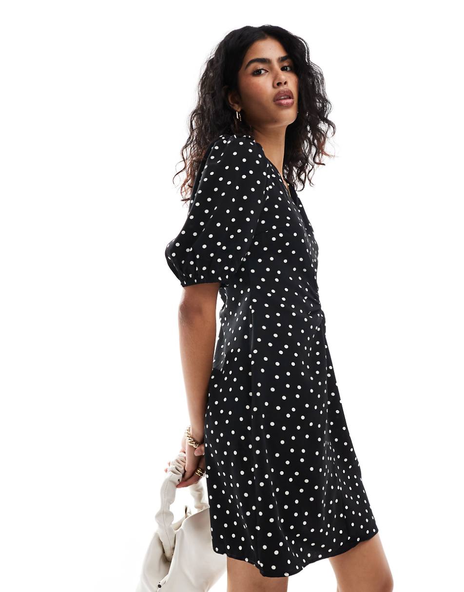 Vila mini dress with tie bow back in black and white polka dot print