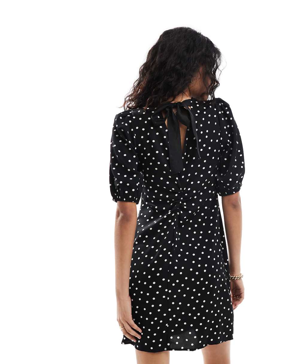 Vila mini dress with tie bow back in black and white polka dot print