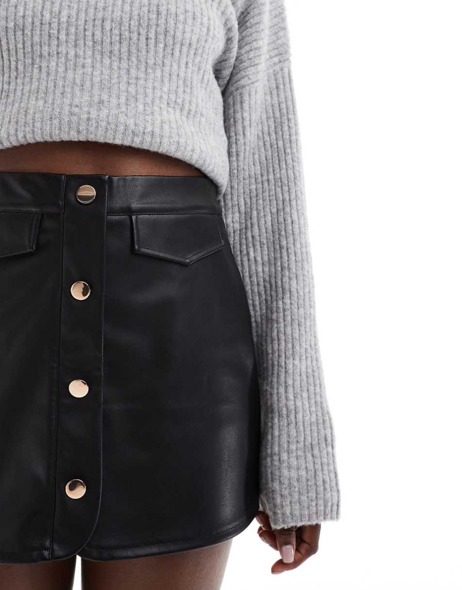 ASOS DESIGN button front pocket detail leather look skort in black