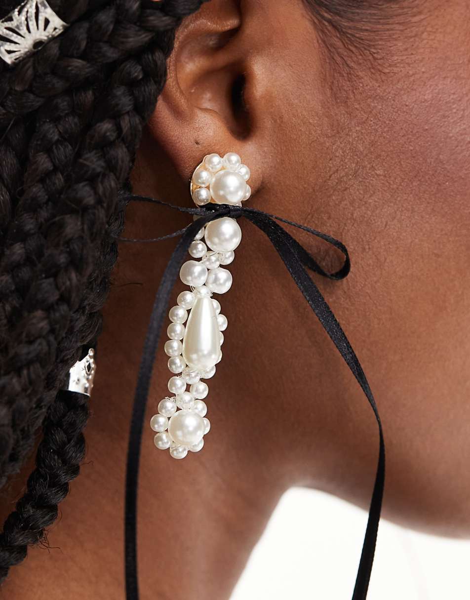 ASOS DESIGN drop earrings with faux pearl and bow detail