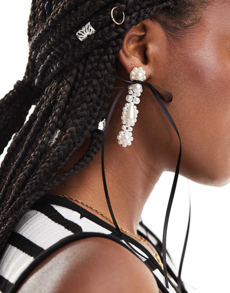 ASOS DESIGN drop earrings with faux pearl and bow detail