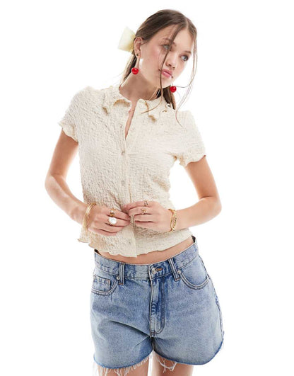 ASOS DESIGN textured polo top with lettuce edge in stone