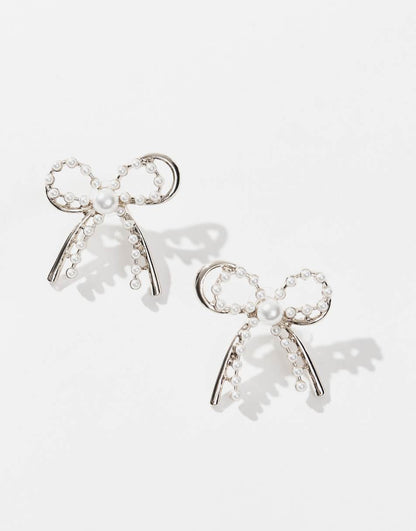 8 Other Reasons rhodium plated pearl embellished bow earrings in gold