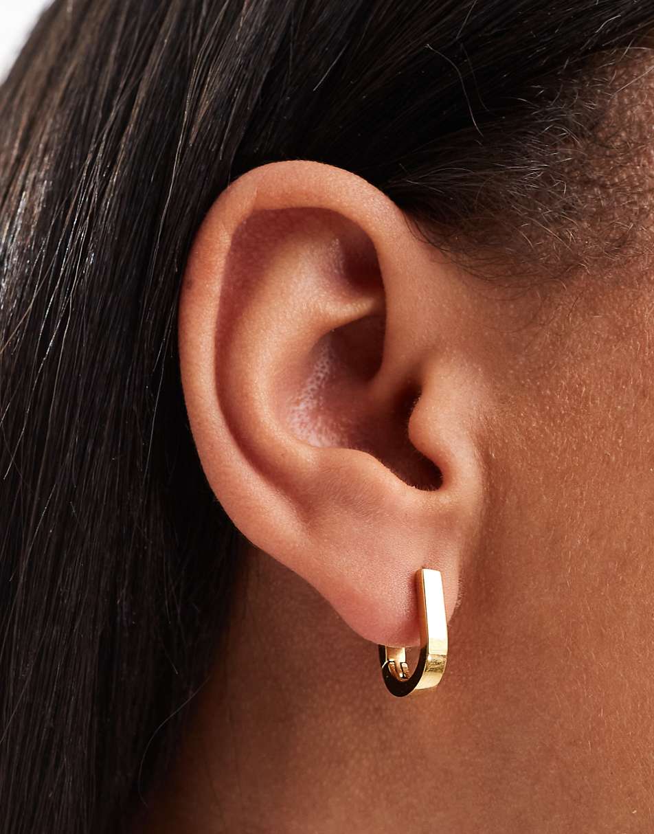 ASOS DESIGN waterproof stainless steel hoop earrings with oval clicker detail in gold tone