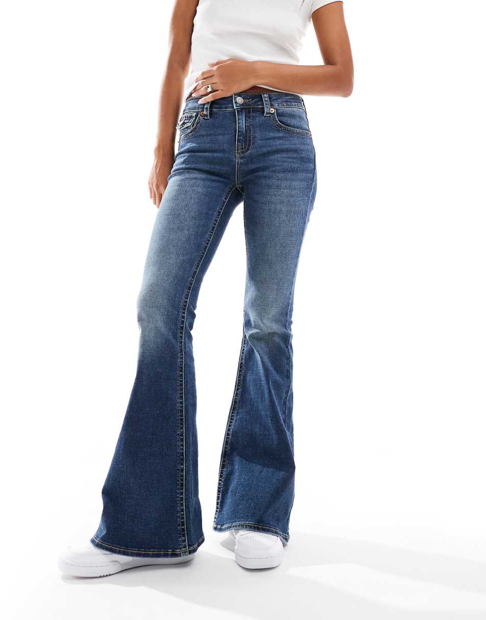 Stradivarius low rise flared jeans in dark blue