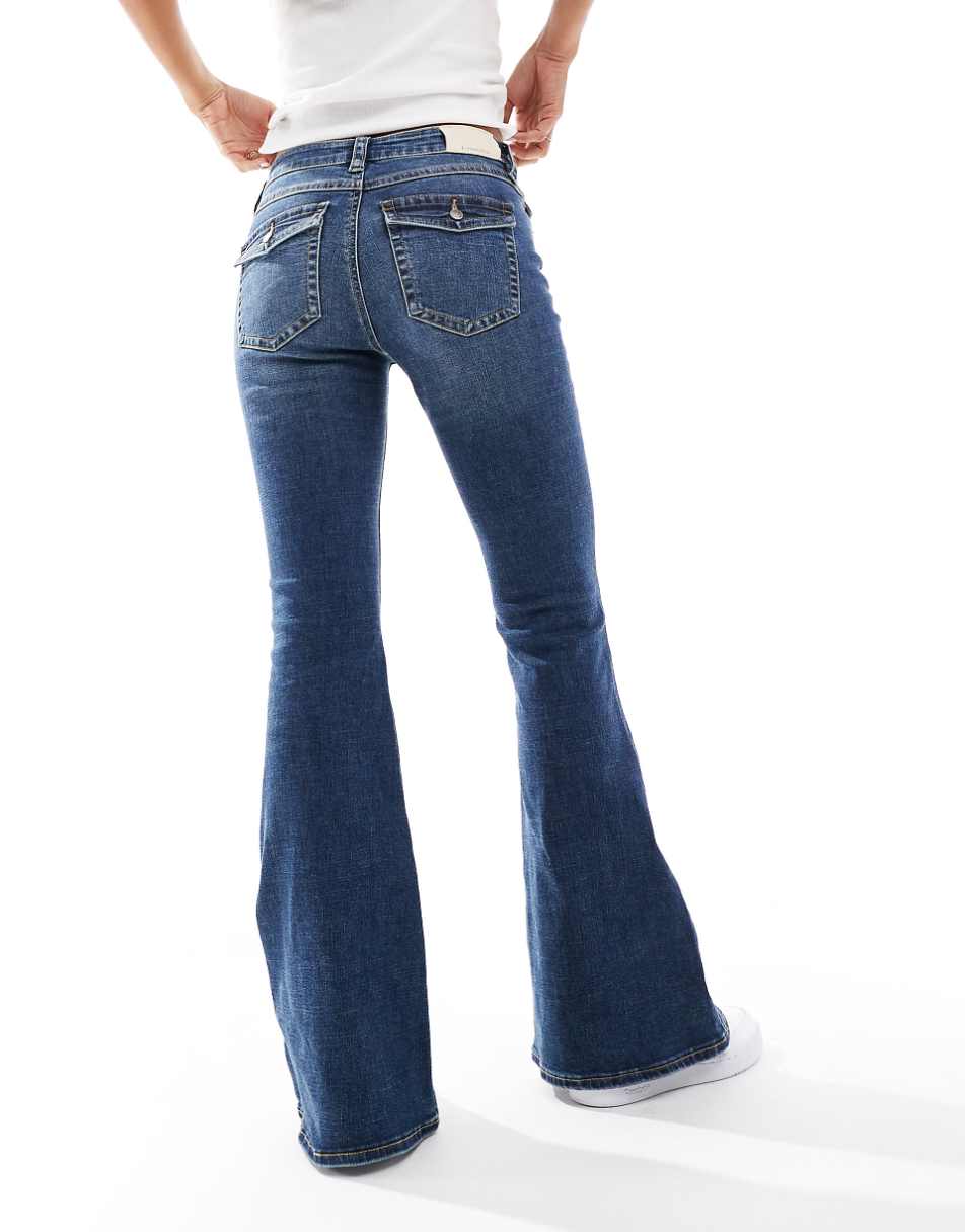 Stradivarius low rise flared jeans in dark blue