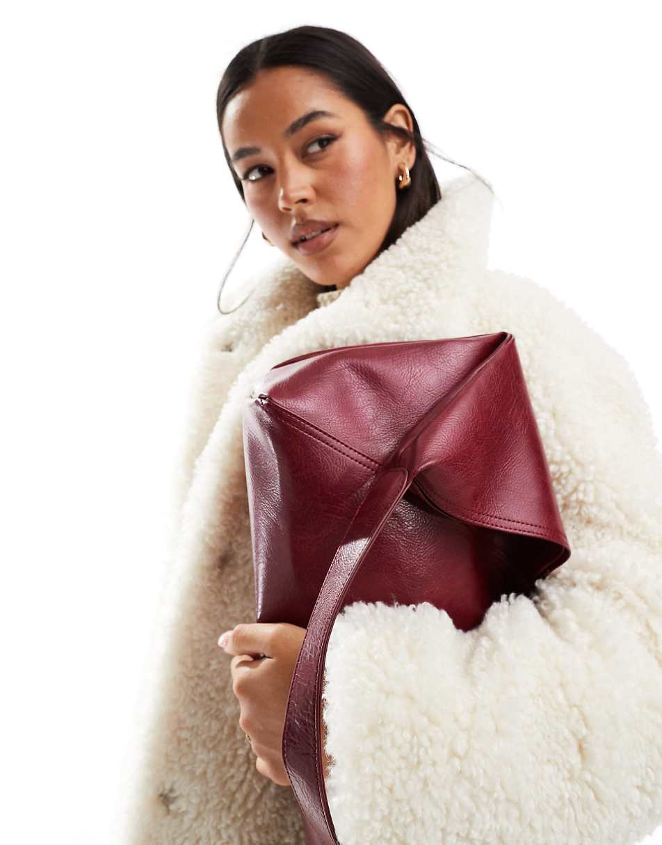 ASOS DESIGN slouch tote bag with crossover panel detail in burgundy