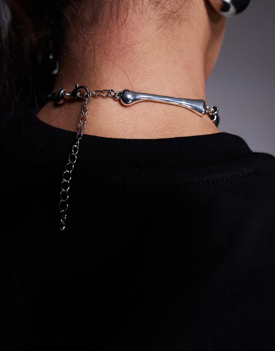 ASOS DESIGN Halloween choker necklace with skeleton hand design