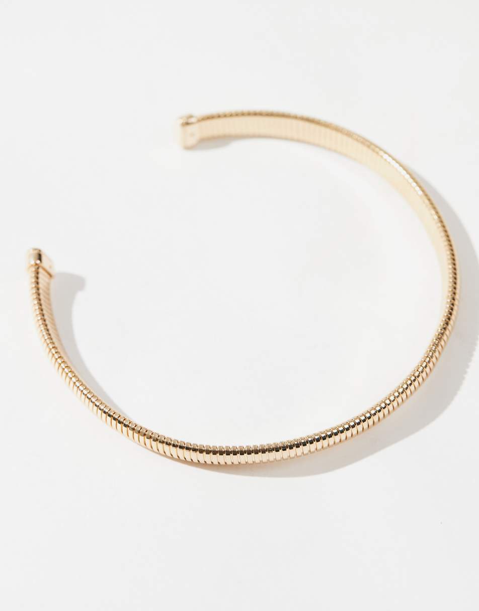 ASOS DESIGN torque choker with ribbed design in gold tone