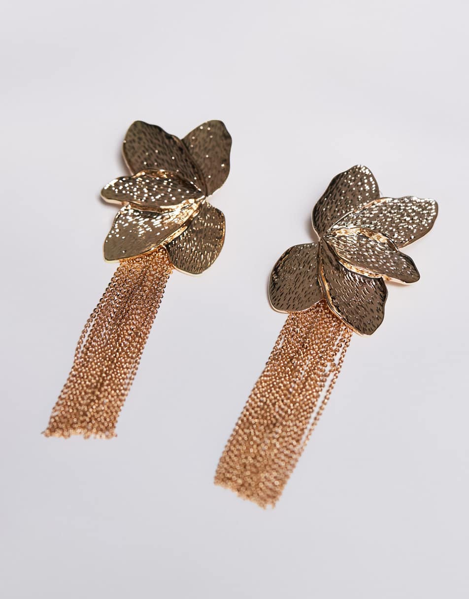 ASOS DESIGN drop earrings in textured petal design with chain tassels in gold tone
